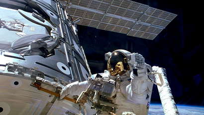 Astronaut James H. Newman waves during a spacewalk preparing for the release of the first combined elements of the International Space Station on November 20, 1998 in this image released on November 20, 2013. The Russian-built Zarya module, with its solar array panel visible here, was launched into orbit fifteen years ago on November 20, 1998. Two weeks later, on December 4, 1998, NASA's space shuttle Endeavour launched Unity, the first U.S. piece of the complex. During three spacewalks on the STS-88 mission, the two space modules built on opposite sides of the planet were joined together in space, making the space station truly international.