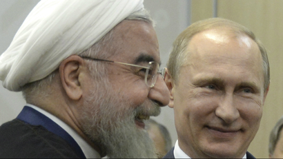 Russian President Vladimir Putin (R) meets with Iran's President Hassan Rouhani in Ufa, Russia, July 9, 2015.