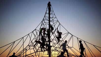 Children play at sunset on a construction in Israel.
