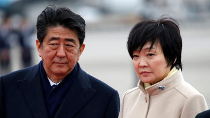 Japan's Prime Minister Shinzo Abe (L) and his wife Akie at Haneda Airport in Tokyo, Japan February 28, 2017.