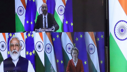 Modi and EU leaders are seen on a video screen