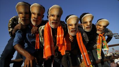 Supporters of Hindu nationalist Narendra Modi wear masks during a rally in Chennai