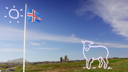 A cartoon sheep and sun on an image of the Icelandic flag in rural Iceland.