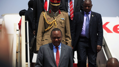 Kenya's President Uhuru Kenyatta (bottom L) arrives at the airport in Juba,