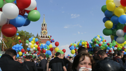 People walk with balloons towards Red Square during a rally in Moscow.