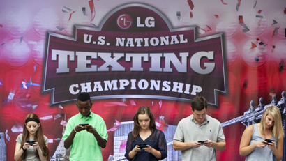 Contestants compete in the 2012 U.S. National Texting Championships in New York, August 8, 2012.