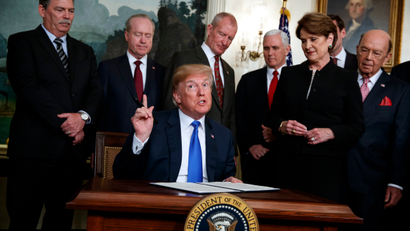 President Donald Trump speaks before he signs a presidential memorandum imposing tariffs and investment restrictions on China in the Diplomatic Reception Room of the White House, Thursday, March 22, 2018, in Washington.