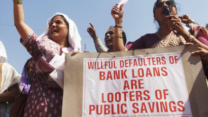Bank employees shout slogans during a demonstration in Bombay