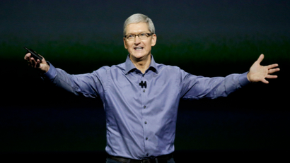 Apple CEO Tim Cook wraps up the latest Apple event at the Bill Graham Civic Auditorium in San Francisco, Wednesday, Sept. 9, 2015. (AP Photo/Eric Risberg)