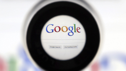 A Google search page is seen through a magnifying glass in this photo illustration taken in Brussels May 30, 2014. Google has taken the first steps to meet a European ruling that citizens can have objectionable links removed from Internet search results, a ruling that pleased privacy campaigners but raised fears that the right can be abused to hide negative information.