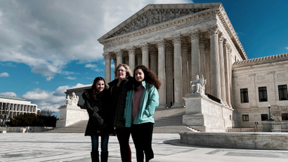Kendra Espinoza and her daughters in front of the US Supreme Court.
