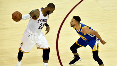 Jun 7, 2017; Cleveland, OH, USA; Cleveland Cavaliers forward LeBron James (23) handles the ball against Golden State Warriors guard Stephen Curry (30) during the fourth quarter in game three of the 2017 NBA Finals at Quicken Loans Arena.
