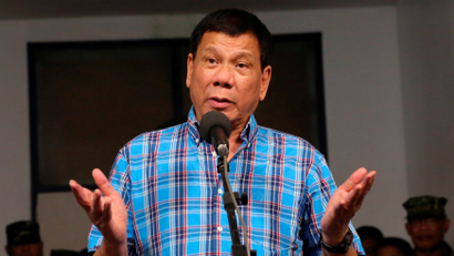 Philippine President Rodrigo Duterte gestures during a briefing with the military after his visit at Camp General Basilio Navarro in Zamboanga City, Philippines November 25, 2016.