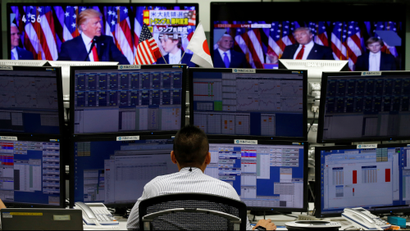Foreign exchange trader at their desk as Trump wins