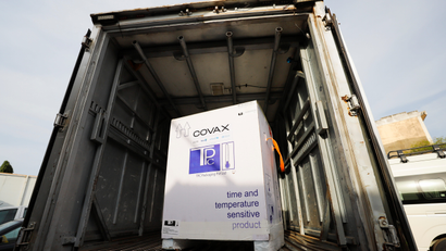 A box of COVID-19 vaccines, redeployed from the Democratic Republic of Congo, is seen loaded into a refrigerated delivery truck in Ghana