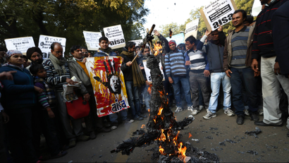 Foot in mouth: Indian students burn an effigy representing Hindu nationalist leaders Asaram Bapu and Mohan Bhagwat. This week, Bapu said the victim of the Delhi gang rape was equally responsible for the attack as her assailants. Bhagwat also made several derogatory statements against women.