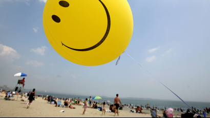 A smiley-face balloon floats over Revere