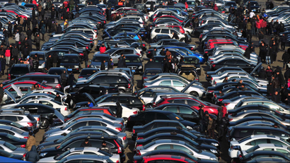 People select automobiles at a second-hand market in Shenyang, Liaoning province December 10, 2011. China's car sales in November rose 0.29 percent from a year earlier to 1.34 million units, the official China Association of Automobile Manufacturers (CAAM) said on Friday. REUTERS/Sheng Li
