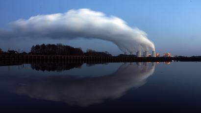 Steam billowing from the cooling towers of Vattenfall's Jaenschwalde brown coal power station.