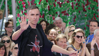 Belgian designer Raf Simons appears at the end of his Haute Couture Fall Winter 2015/2016 fashion show for French fashion house Christian Dior in Paris, France, July 6, 2015. REUTERS/Stephane Mahe