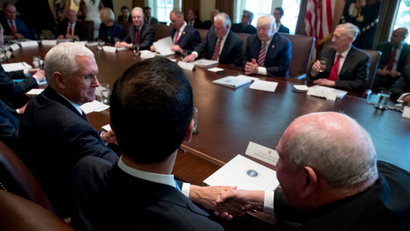 Vice President Mike Pence, left, shakes hands with Agriculture Secretary Sonny Perdue, right, during President Donald Trump's Cabinet meeting, Monday, June 12, 2017, in the Cabinet Room of the White House in Washington.