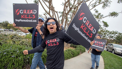 AIDS advocates participate in a rolling protest caravan in Rancho Palos Verdes, CA, Wednesday June 8, 2016, targeting Gilead Sciences over its drug pricing and policies during the drug giant's presentation at Goldman Sachs’ Annual Healthcare Conference at the exclusive Terranea Resort. The protest followed a recent and blistering Los Angeles Times article that revealed Gilead’s blatant patent manipulation in order to maximize profits on its drugs containing tenofovir, a key HIV/AIDS drug. The protest included a hearse, a double-deck bus and 30-40 individual cars featuring placards and banners reading ‘Gilead Greed Kills.’
