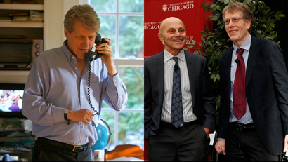 Robert Shiller, one of three American scientists who won the 2013 economics Nobel prize, speaks on the phone at his home in New Haven, Connecticut October 14, 2013. University of Chicago professors Eugene F. Fama (L) and Lars Hansen attend a news conference after it was announced they won the 2013 Nobel Prize in Economics in Chicago, October 14, 2013.