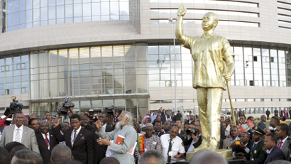 Dignitaries and delegates mill around a statue of Ghana's late leader Kwame Nkrumah at the opening of the new African Union headquarters in Ethiopia's capital Addis Ababa January 28, 2012.