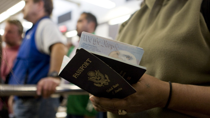 A traveler holds US passports