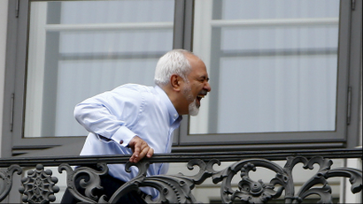 Iranian Foreign Minister Javad Zarif stands on the balcony of Palais Coburg, the venue for nuclear talks, Austria, July 13, 2015.