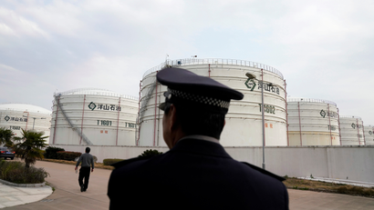 Oil tanks are seen at an oil warehouse at Yangshan port in Shanghai, China