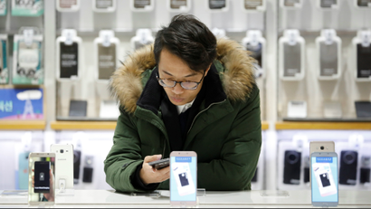 A man tries out a Samsung Electronics' smartphone at its store in Seoul, South Korea, January 23, 2017.