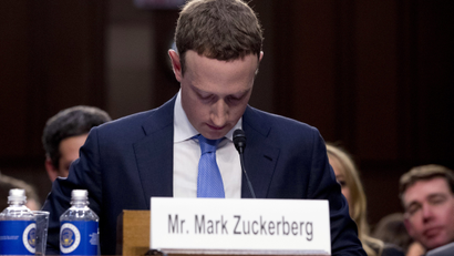 Facebook CEO Mark Zuckerberg looks down as a break is called during his testimony before a joint hearing of the Commerce and Judiciary Committees on Capitol Hill in Washington, Tuesday, April 10, 2018, about the use of Facebook data to target American voters in the 2016 election. (AP Photo/Andrew Harnik)