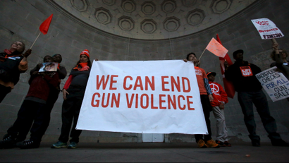 People stand in Central Park's Naumburg Bandshell during a march against gun violence, held ahead of...