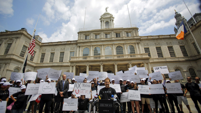 Uber riders and driver-partners take part in a rally on steps of New York City Hall against proposed legislation limiting for-hire vehicles in New York June 30, 2015.