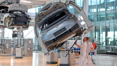 Technicians work in the assembly line of German carmaker Volkswagen's electric ID.3 car in Dresden, Germany.