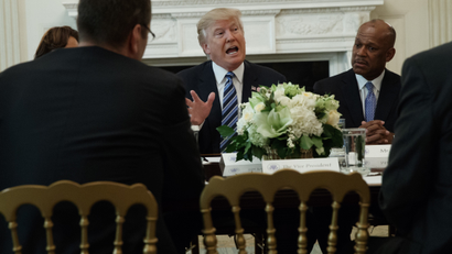 UPS President of US operations Myron Gray, right, listens as President Donald Trump speaks during a meeting with airline executives in the State Dining Room of the White House in Washington, Thursday, Feb. 9, 2017. (AP Photo/Evan Vucci)