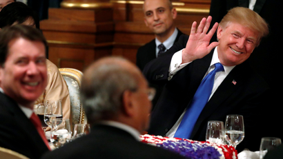 U.S. President Donald Trump waves to an attendee at an official dinner for thrown in his honor by Japan's Prime Minister Shinzo Abe at Akasaka Palace in Tokyo, Japan November 6, 2017.