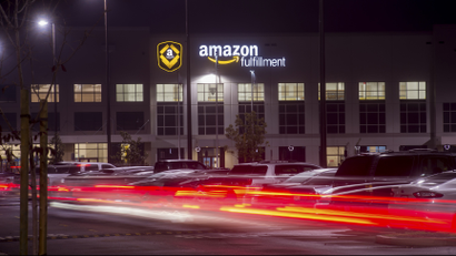 Employees arrive for work at an Amazon Fulfillment Center, ahead of the Christmas rush, in Tracy, California