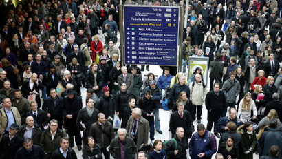 Stranded commuters wait for instructions after trains were delayed at Liverpool Street station in London.