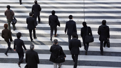 businesspeople crossing a street