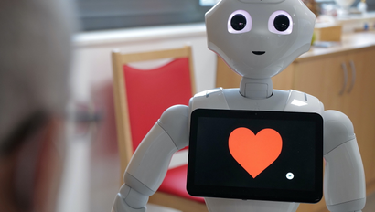 With a heart on its screen, humanoid robot "Pepper" brightens up the daily life of guests at the day care center of German welfare organization Caritas.