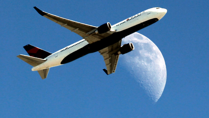 Delta Airlines flight flies by moon