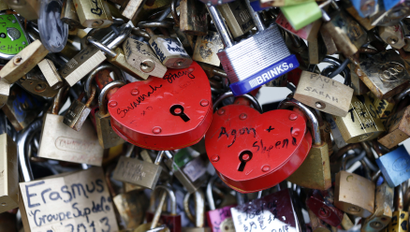 Thousands of padlocks clipped by lovers are seen on the fence of the Pont des Arts over the River Seine in Paris