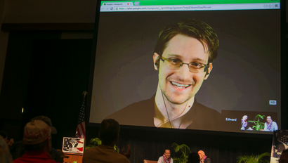 National Security Agency leaker Edward Snowden appears on a live video feed broadcast from Moscow at an event sponsored by the ACLU Hawaii in Honolulu on Saturday, Feb. 14, 2015.