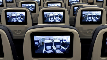 TV screens, installed on board of an Airbus A350 XWB flight-test aircraft are pictured during a media-day at the German headquarters of aircraft company Airbus in Hamburg-Finkenwerder