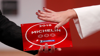 A plaque with the 2018 three Michelin stars is displayed during the Michelin Guide 2018 award ceremony at the Seine Musicale center in Boulogne-Billancourt near Paris, France, February 5, 2018. REUTERS/Gonzalo Fuentes - RC12A40F33B0