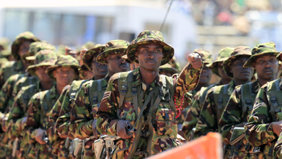 Kenyan soldiers march during celebrations to mark Kenya's Madaraka Day, the 51st anniversary of the country's independence, at Nyayo national stadium in Nairobi, June 1, 2014.