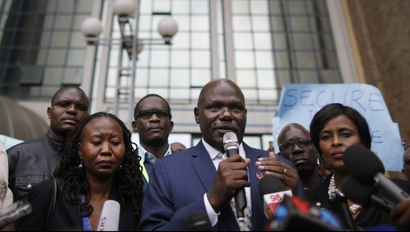 epa06119763 Wafula Chebukati (C), the chairman of Kenya's Independent Electoral and Boundaries Commission (IEBC), addresses the media in front of the IEBC headquarters after meeting the members of the civil society who protested against the killing of Chris Msando, the ICT manager at the IEBC, in Nairobi, Kenya, 01 August 2017. Chebukati urged public not to speculate on Msando's death. Msando, who was in charge of the electronic voting system, went missing on 28 July before his body, with alleged signs of torture, was found on the outskirts of Nairobi on 31 July. Kenya will hold general elections on 08 August.