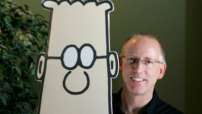 Scott Adams, creator of the comic strip Dilbert, poses for a portrait with the Dilbert character in his studio in Dublin, Calif., Thursday, Oct. 26, 2006. Adams, 49, appears to be a rare example of someone who has largely but not totally, recovered from Spasmodic Dysphonia, a mysterious disease in which parts of the brain controlling speech shut down or go haywire. As many as 30,000 Americans are afflicted, typically in their 40s and 50s, experts say. (AP Photo/Marcio Jose Sanchez)